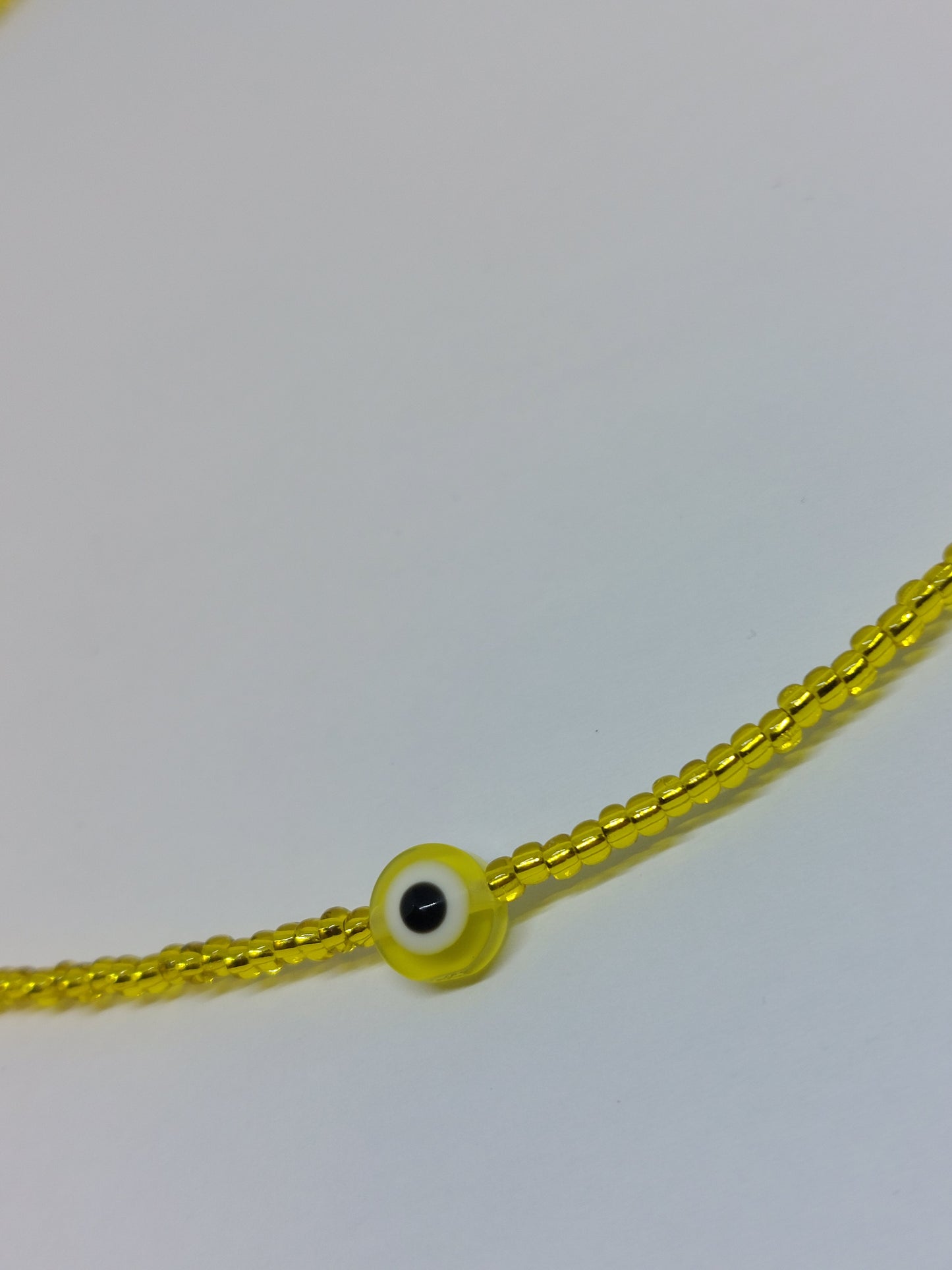 Evil eye ketting geel