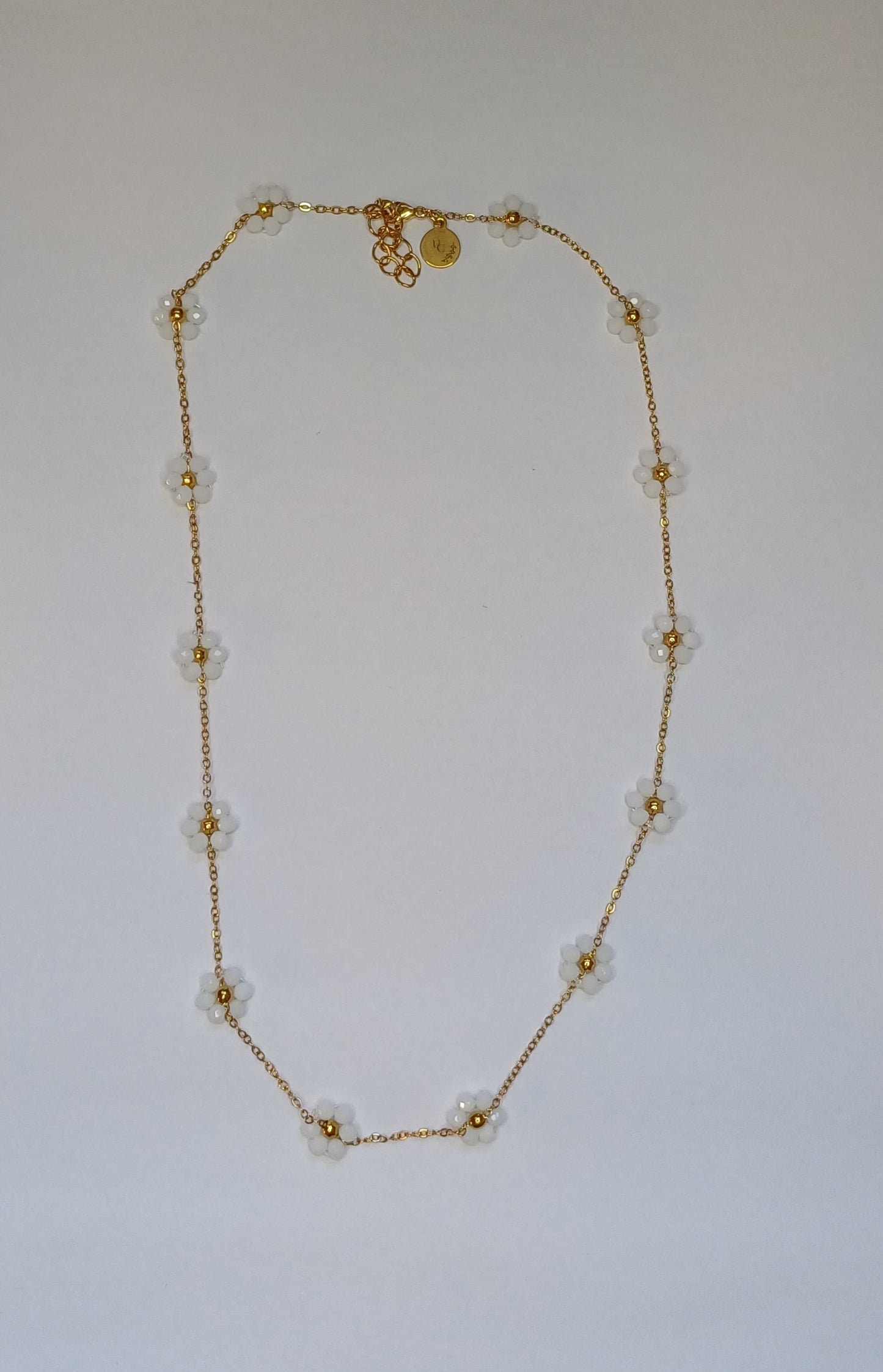 Golden flower mat wit ketting