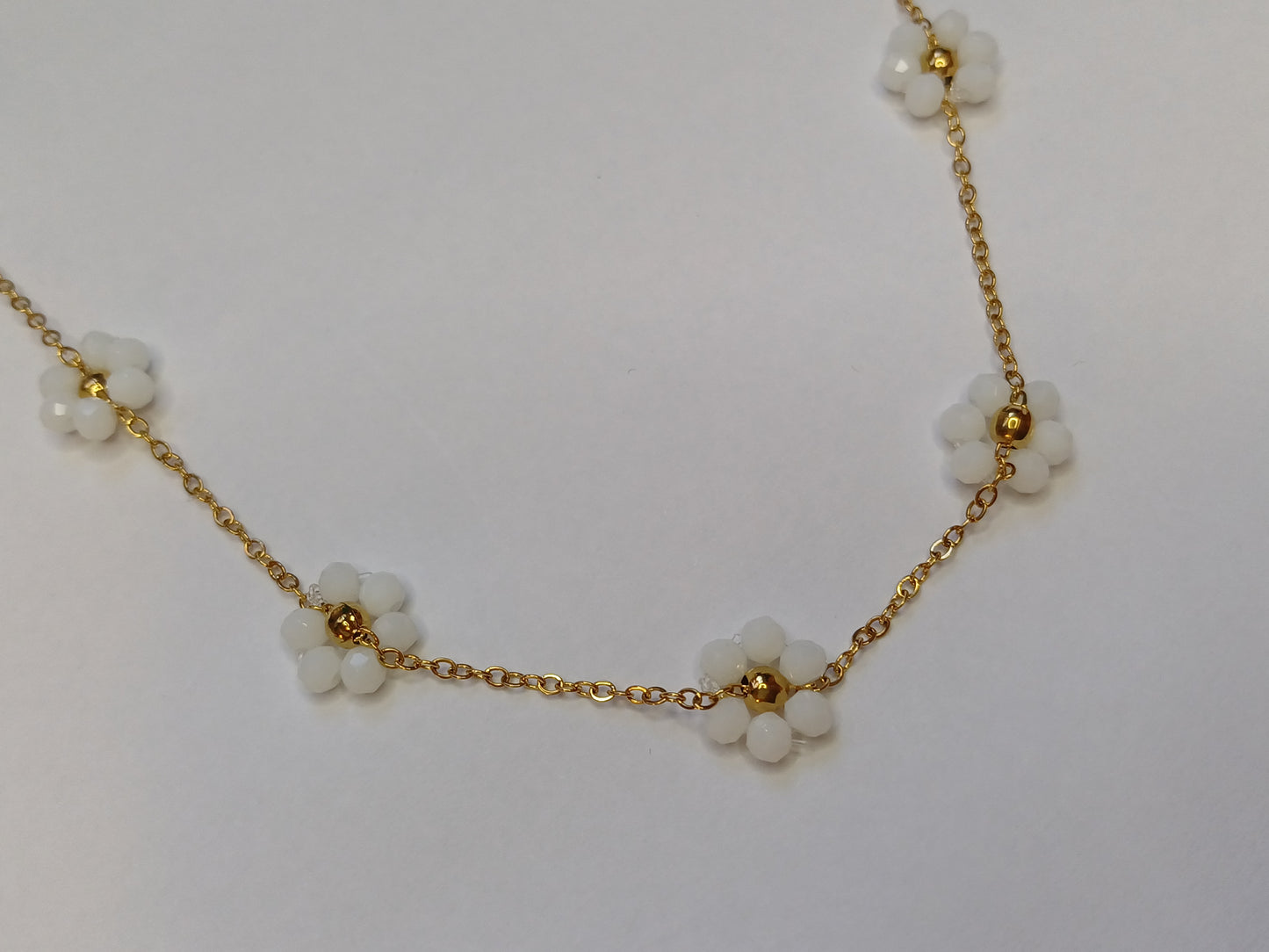 Golden flower mat wit ketting