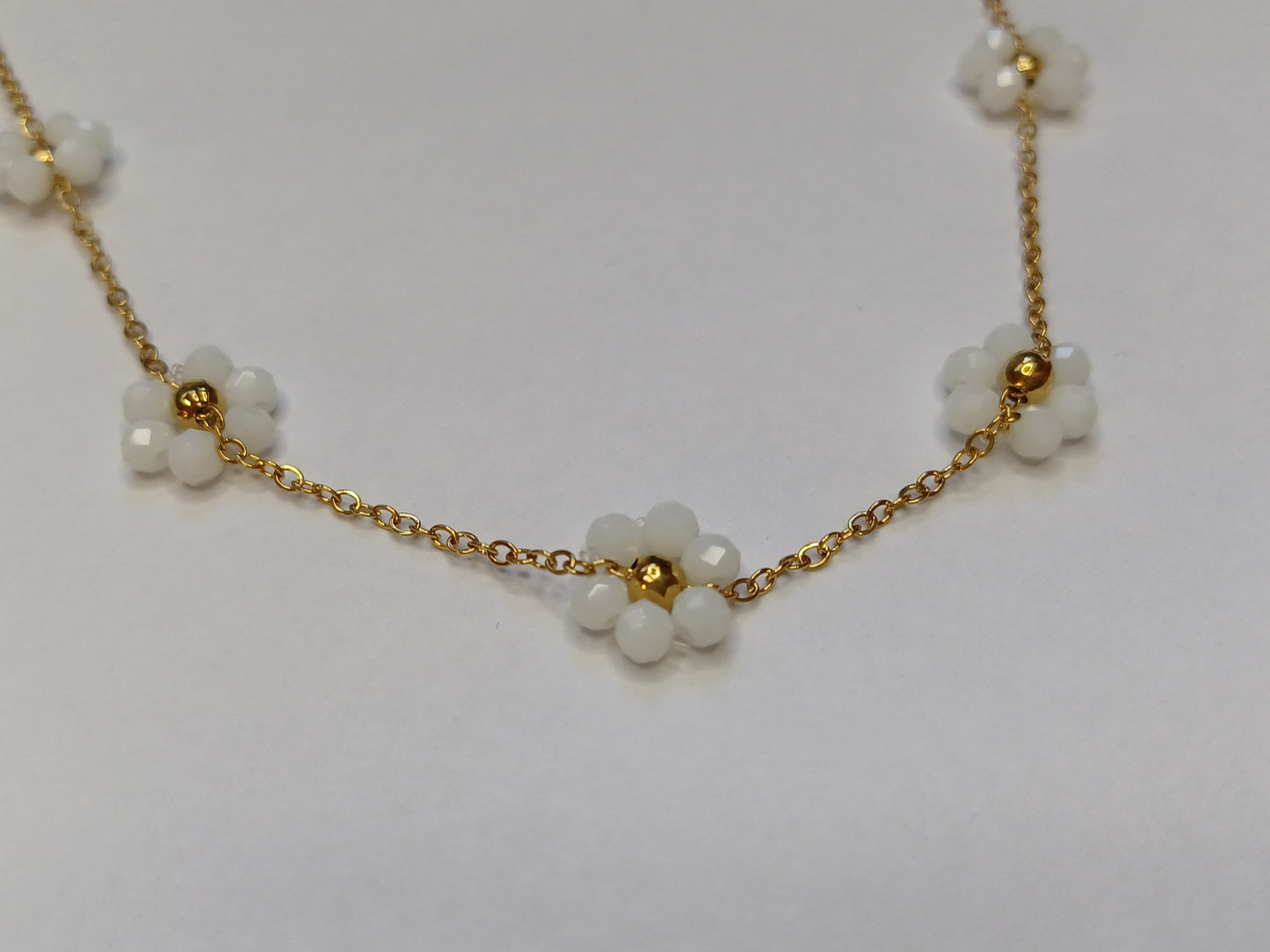 Golden flower mat wit ketting