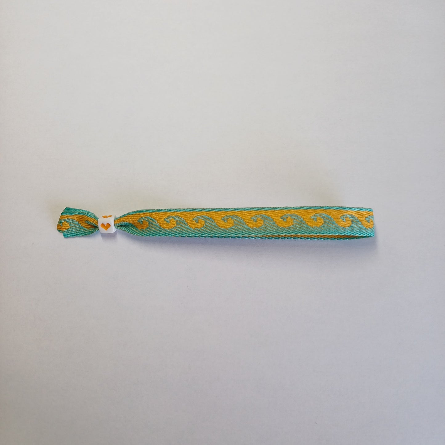 Oranje/turquoise golven lintbandje