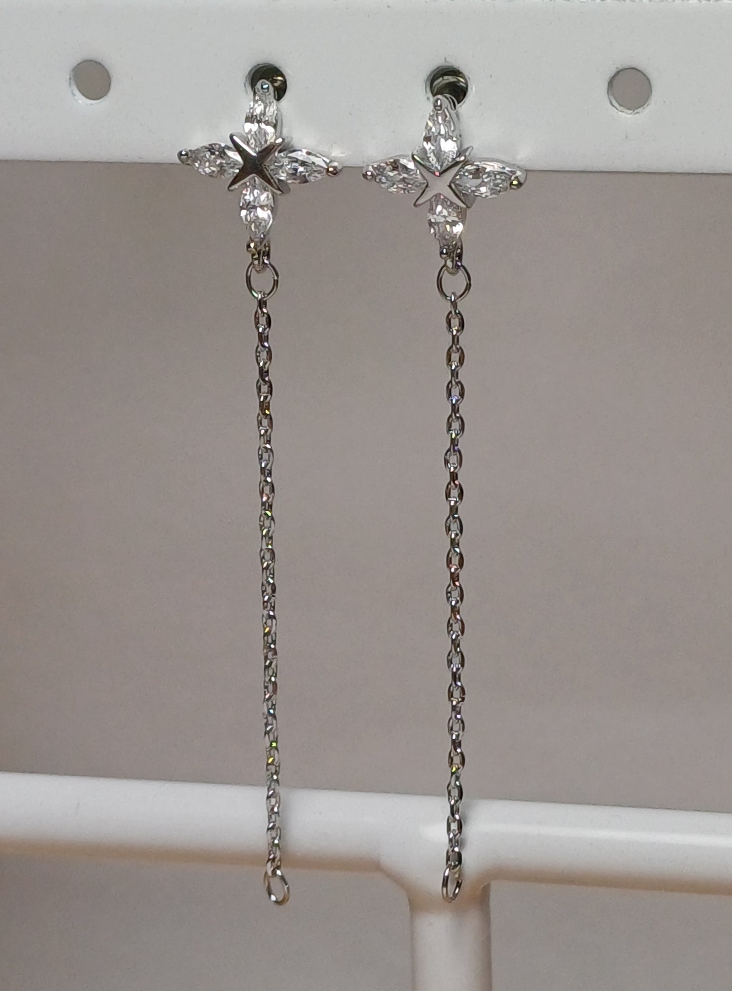 Long flower earrings.