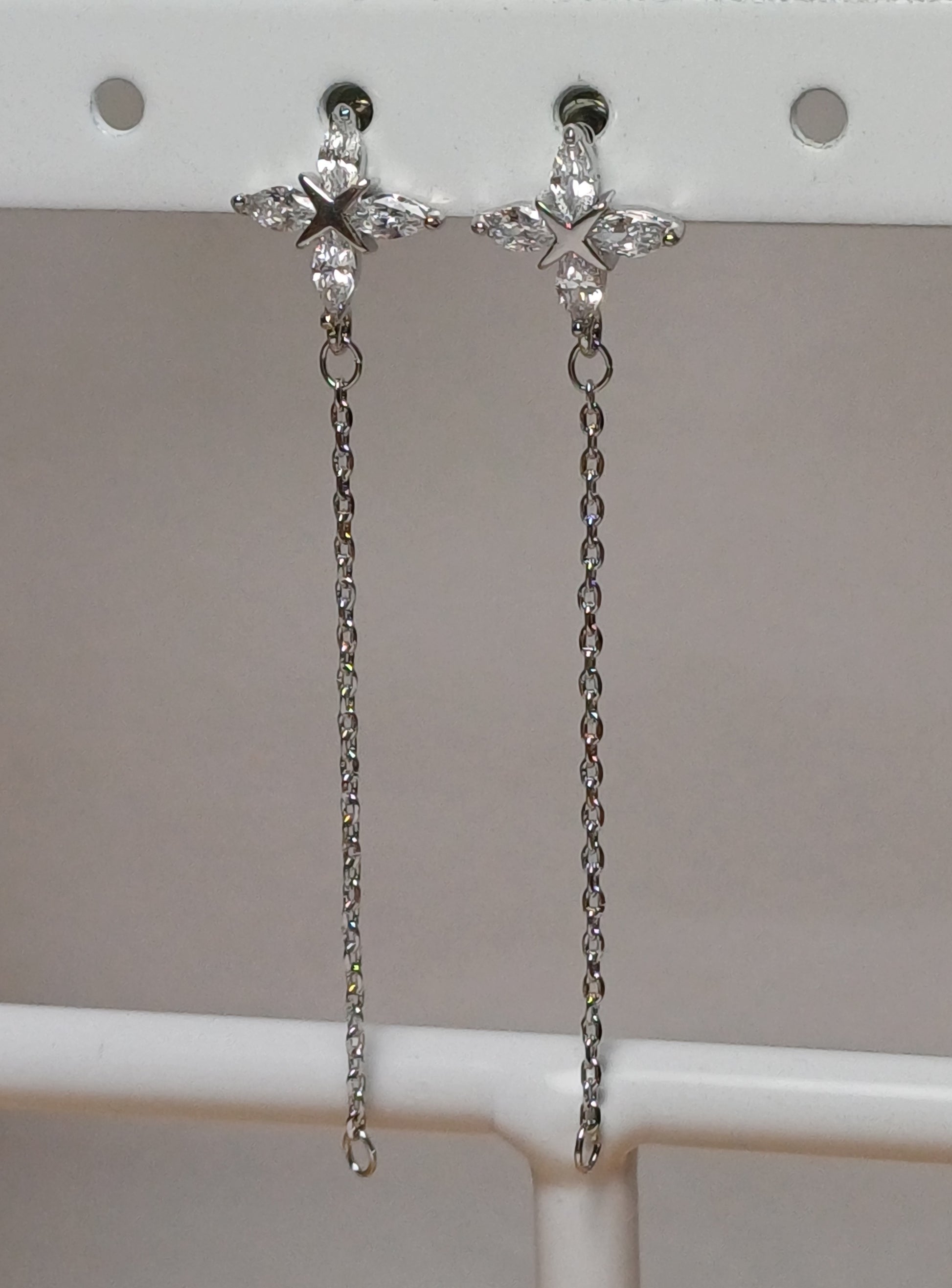 Long flower earrings.