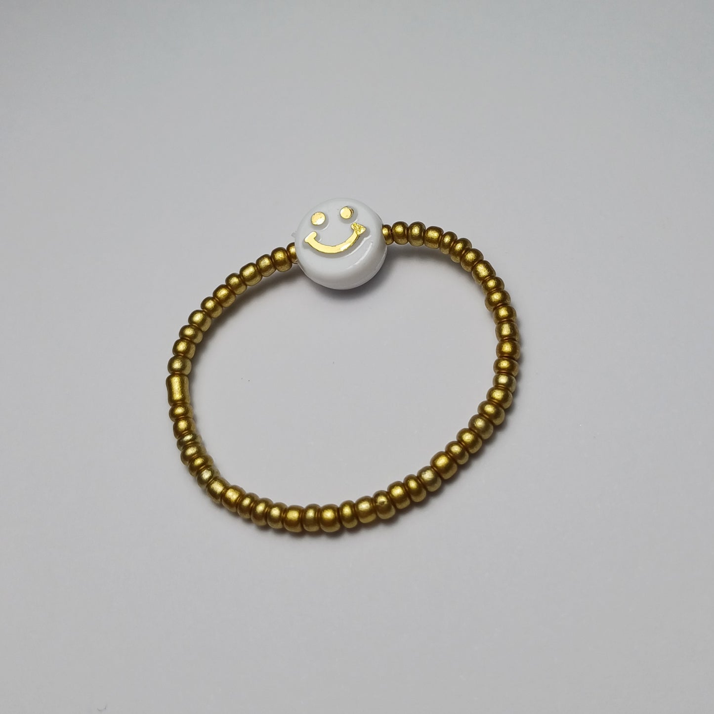 Gouden smiley kinder armbandje