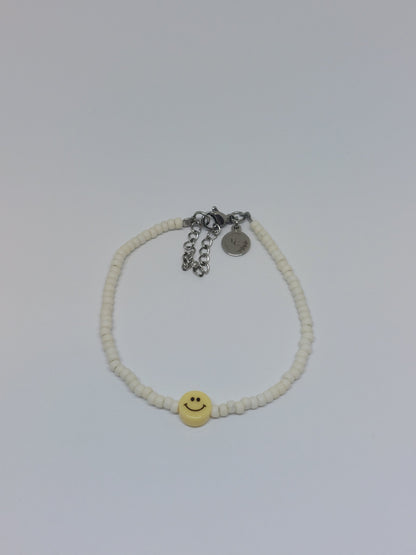 Yellow smiley armband