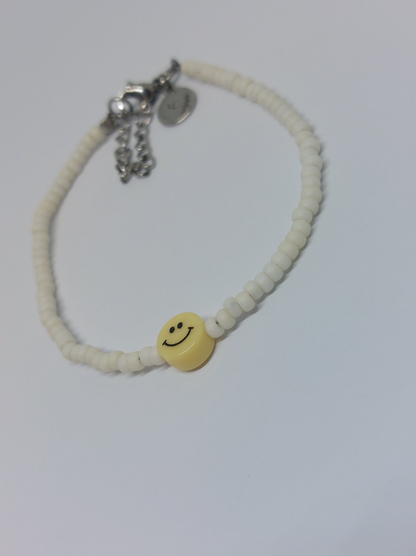 Yellow smiley armband