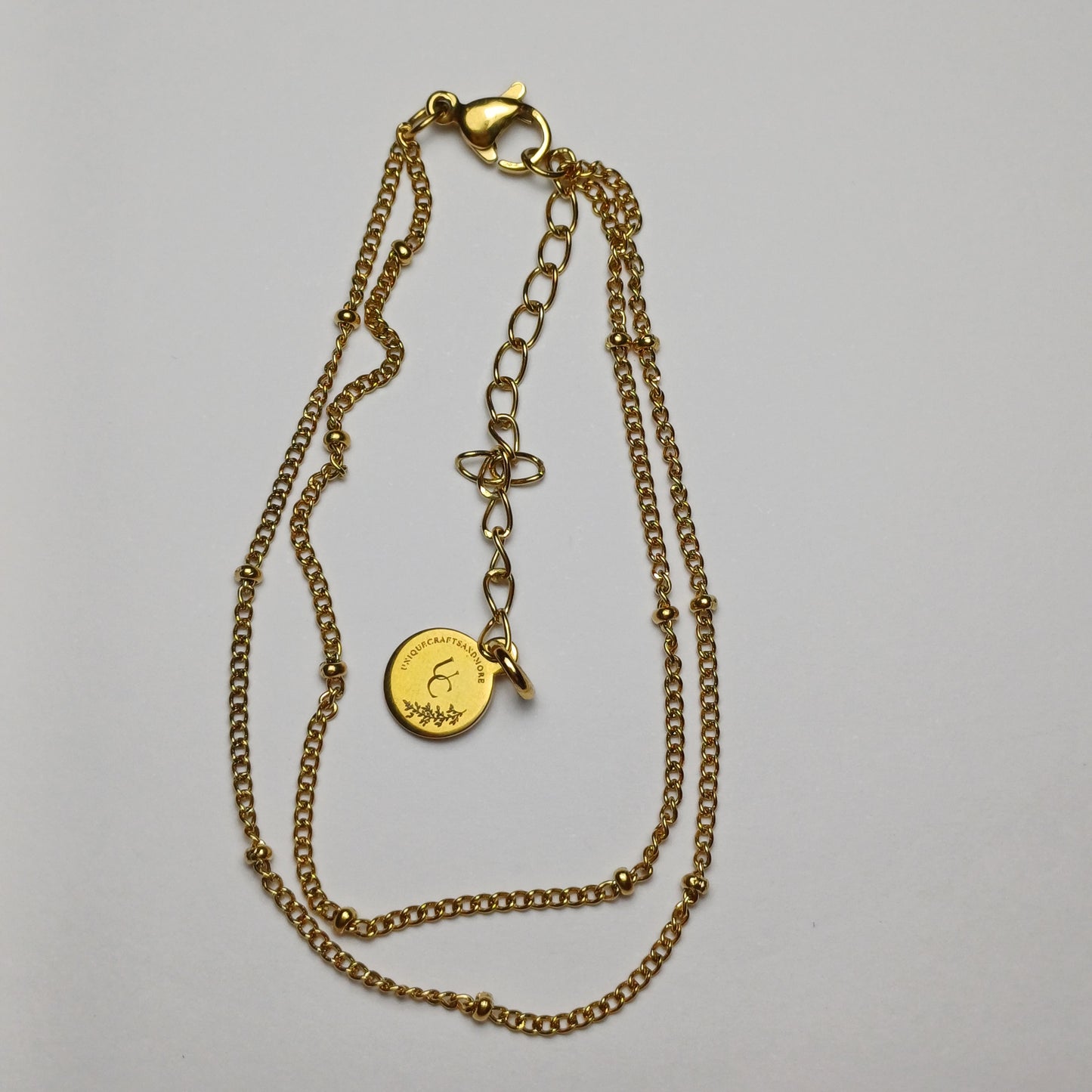 Dubbele armband met bolletjes