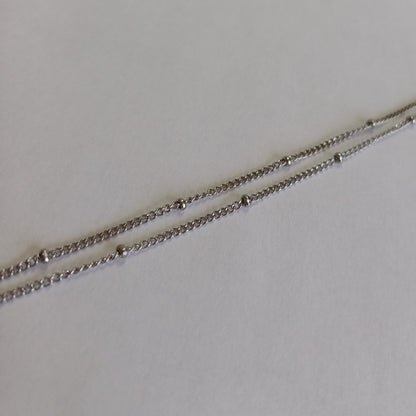 Dubbele armband met bolletjes